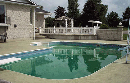 In-ground swimming pool with old green liner